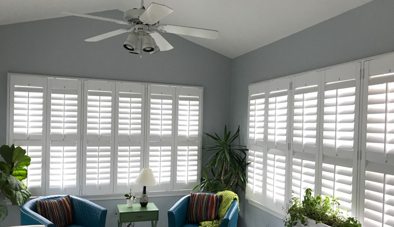 Fort Myers sunroom with fan and shutters